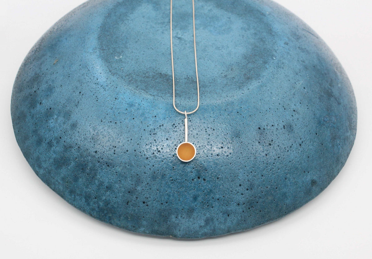 Yellow ochre round shape pendant