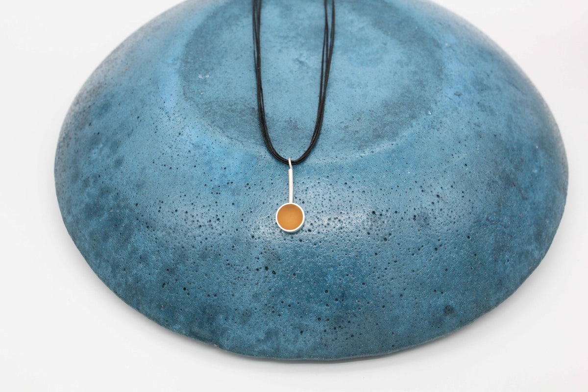 Yellow ochre round shape pendant
