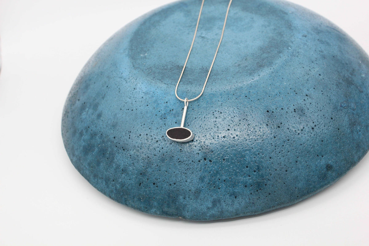 Black oval shape pendant